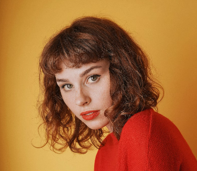 girl with curly hair on a long background
